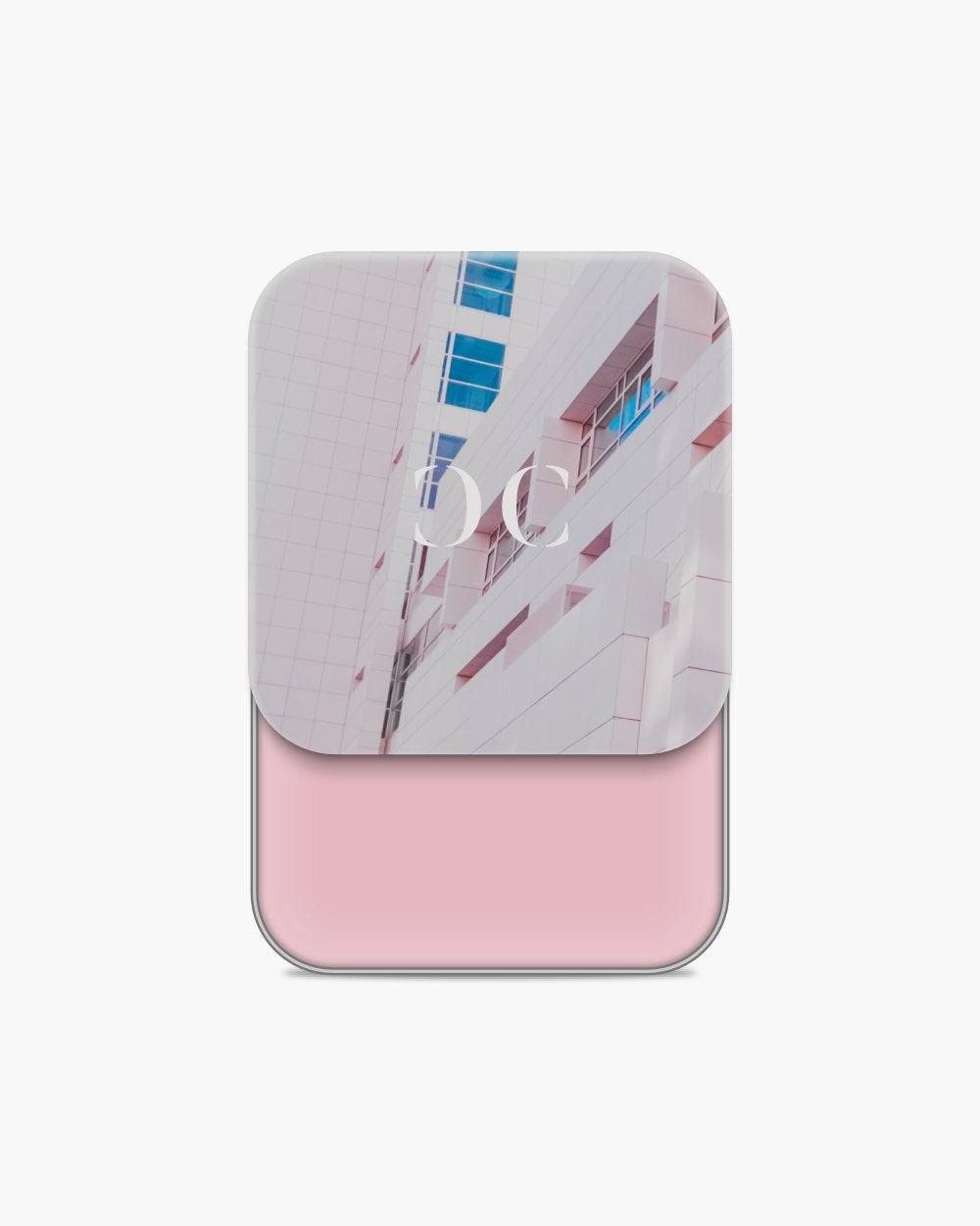 Seint Cream Corrector with cool light-pink cream, its lid showing a pale pink building with blue windows