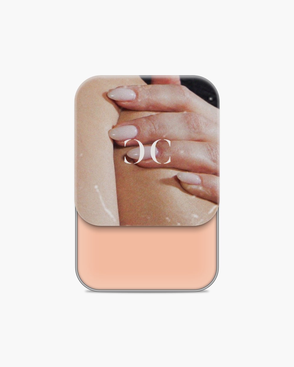 Seint Cream Corrector tin slid open to a light peach cream, lid artwork of hands resting on bare skin