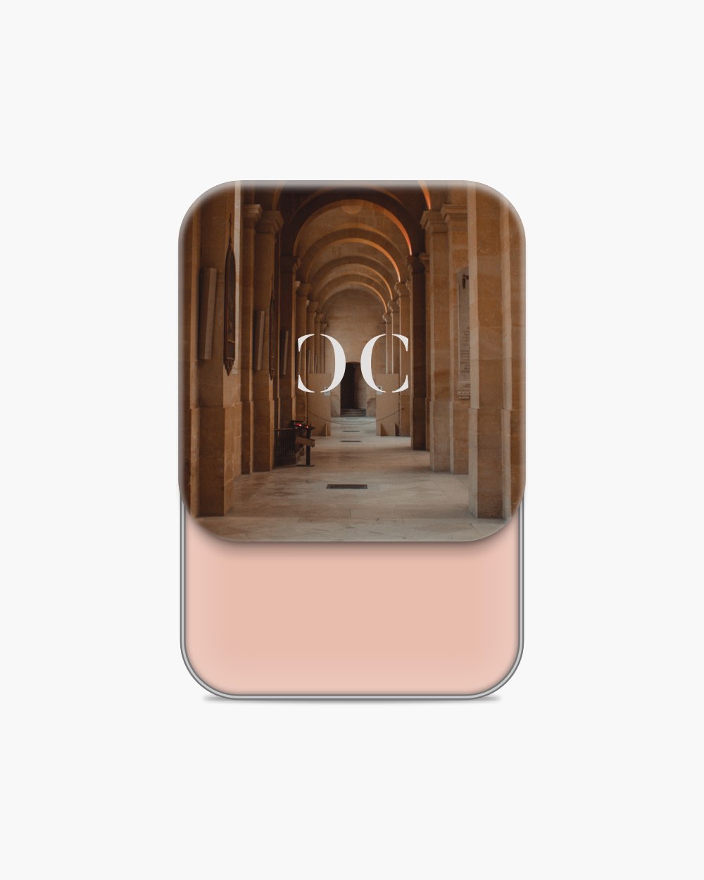 Seint Cream Corrector open to a soft pink-beige cream, arched stone colonnade pictured on the lid