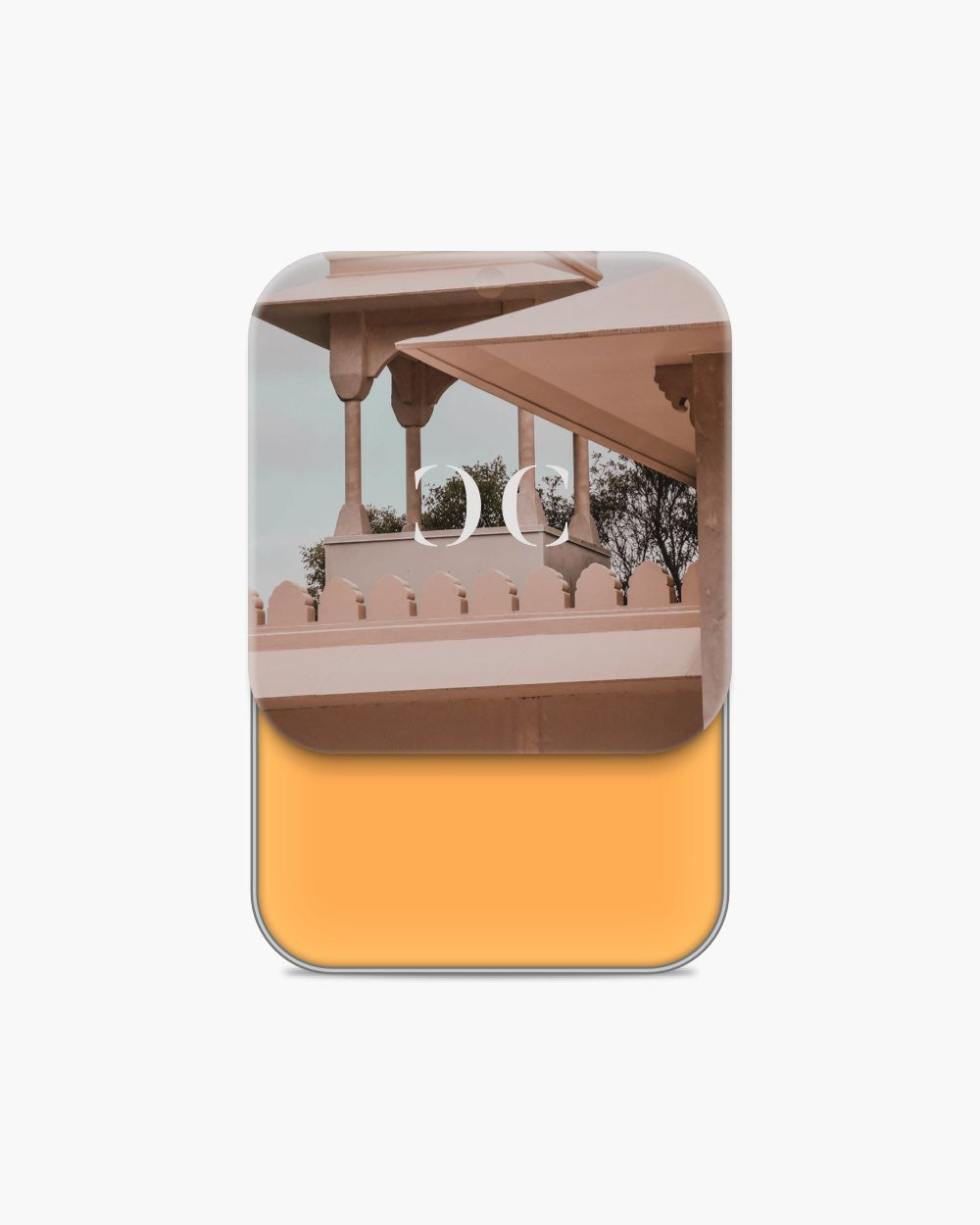 Seint Cream Corrector slid open to a golden marigold cream, pale pavilion architecture on the lid