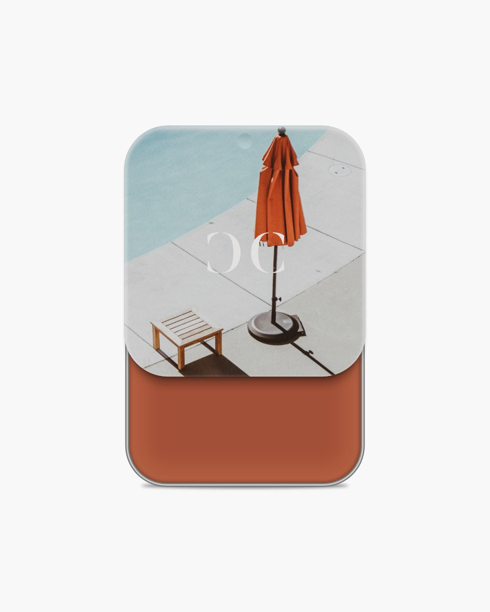 Seint Cream Corrector with deep rust-orange cream, its lid showing a poolside umbrella from above