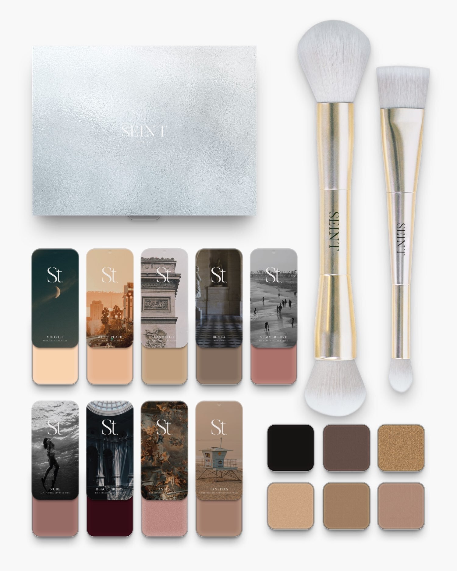 Seint No. 12 Collection Level I flat lay: silver box, two gold brushes, nine fair ivory and rose cream tins, six eyeshadows