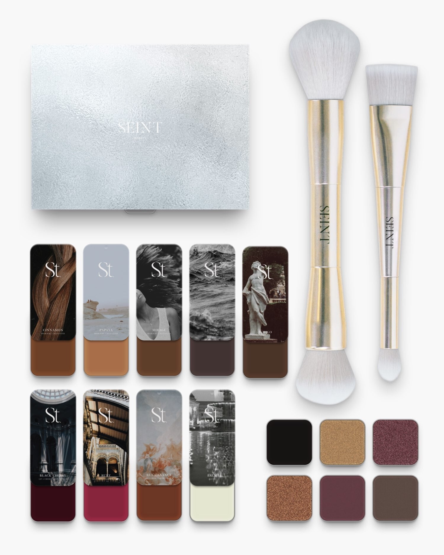 Seint No. 12 Collection Level XI: espresso brown creams, wine blushes and a pale cream illuminator beside brushes and pans
