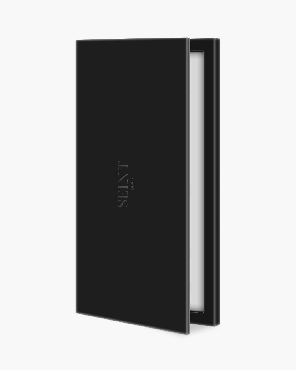 Seint Cream Corrector Palette 18 in matte black, a tall slim case shown ajar with its interior mirror just visible