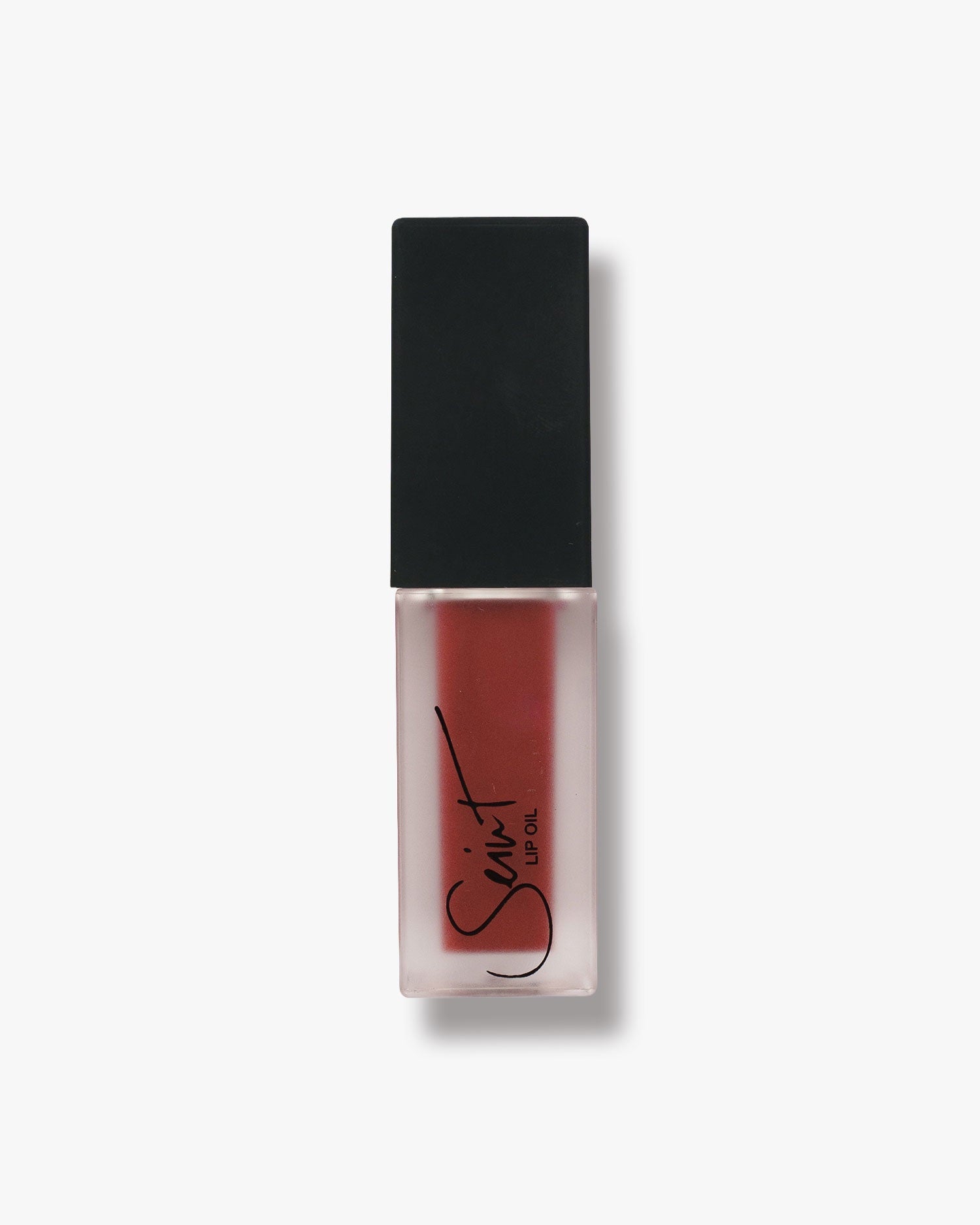 Seint Lip Oil in Black Cherry, deep berry-red oil visible through the frosted logo bottle