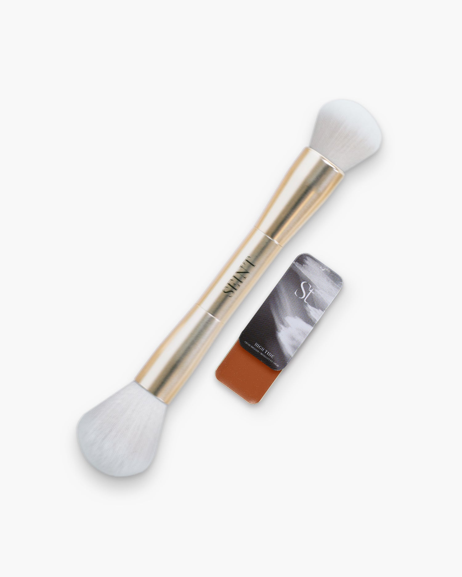 Seint Bronzer Bundle: gold double-ended Blush + Bronzer Brush beside a High Tide cream bronzer tin in warm terracotta