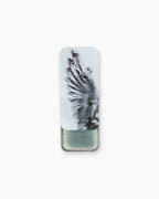 Seint Brow Wax slide-top tin partly open, its lid printed with a blurred wing photo above the clear wax pan
