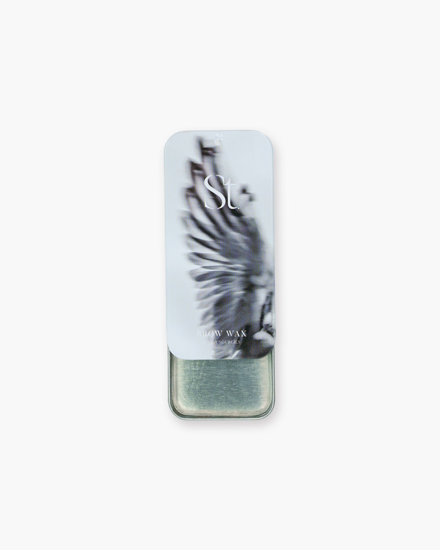 Seint Brow Wax slide-top tin partly open, its lid printed with a blurred wing photo above the clear wax pan