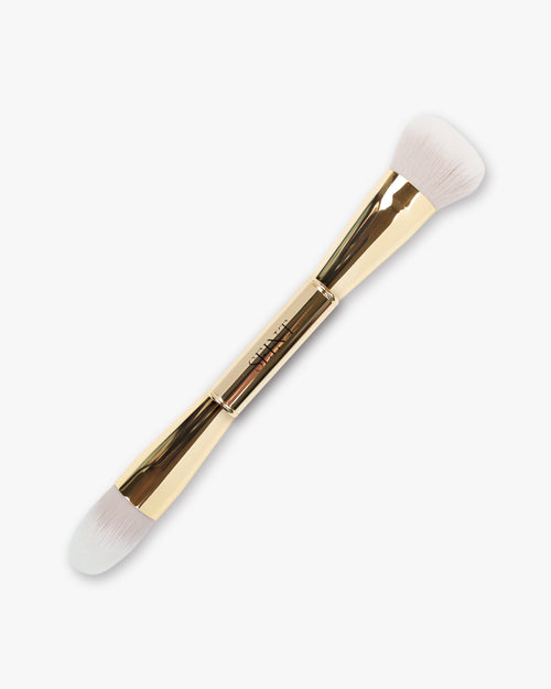 Seint Pilot Brush in gold — double-ended brush with a full rounded powder head and a smaller flat tapered end