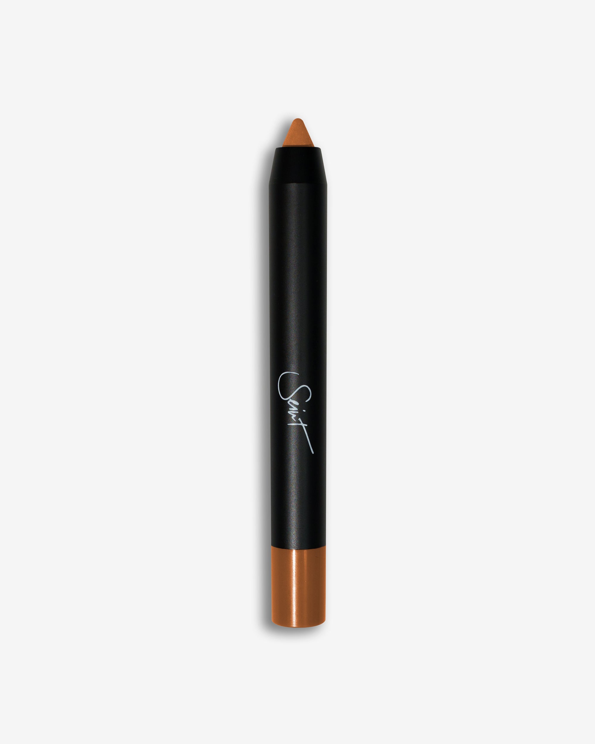 Seint Pencil in Caramel, its exposed tip and cap a warm amber caramel-orange on the black crayon