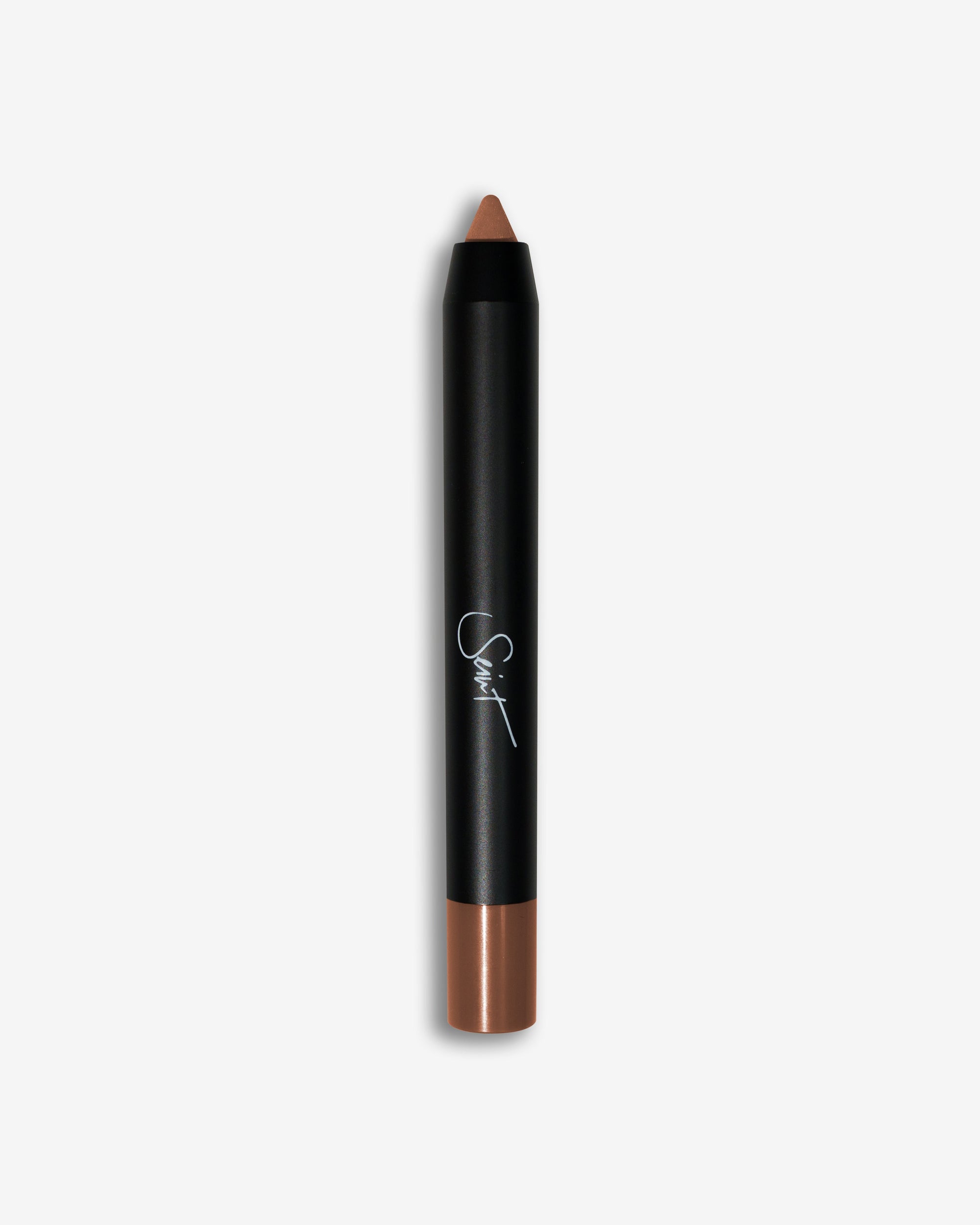 Seint Pencil in Chai with a warm caramel-tan cream tip on a matte black barrel signed with the Seint script logo