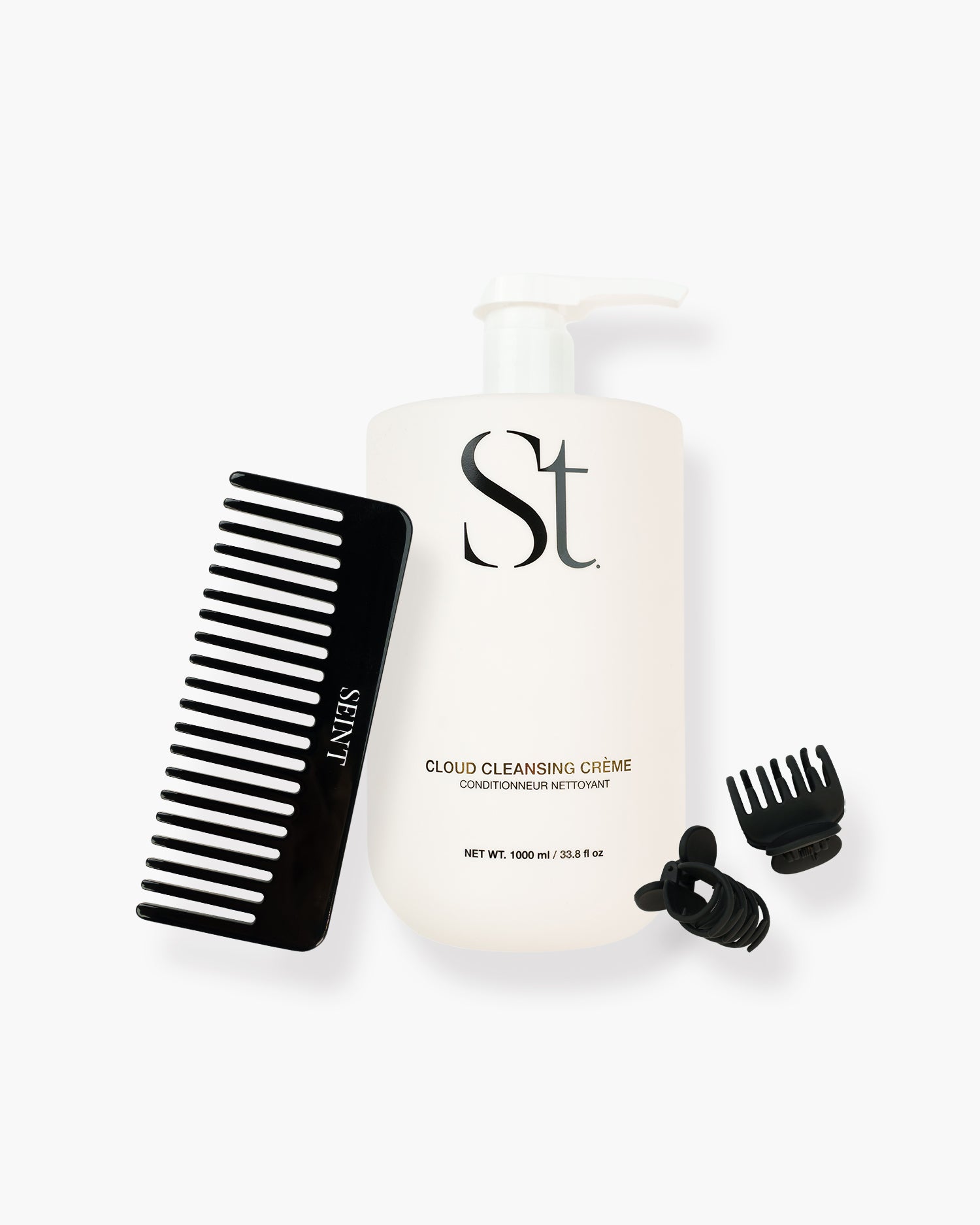 Seint Cleansing Bundle: Cloud Cleansing Crème pump bottle with black wide-tooth comb and two black claw clips