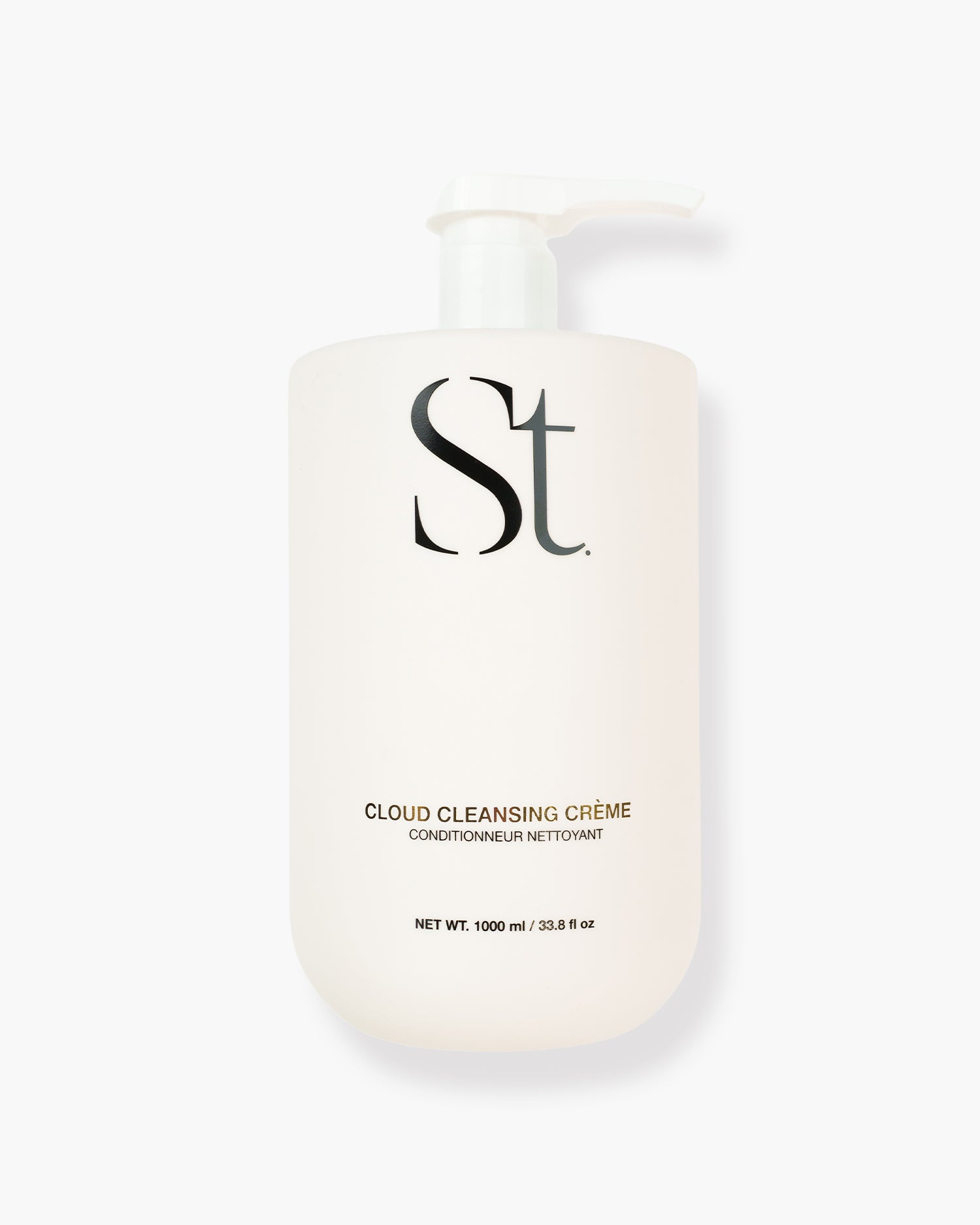 Seint Cloud Cleansing Crème: cream 1000 ml pump bottle with black Seint wordmark and gold lettering