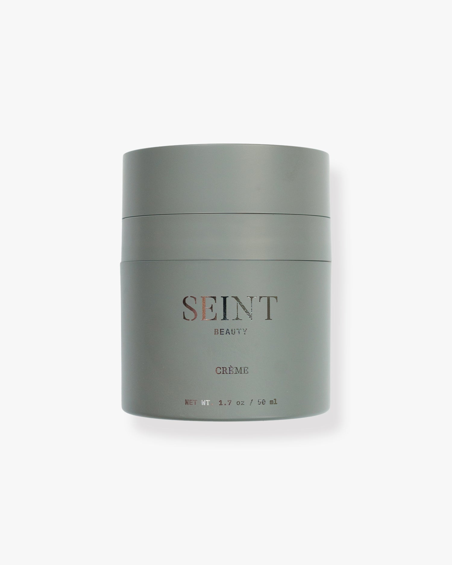 Seint Crème moisturizer in a matte sage-gray 1.7 oz pump jar with the SEINT Beauty wordmark