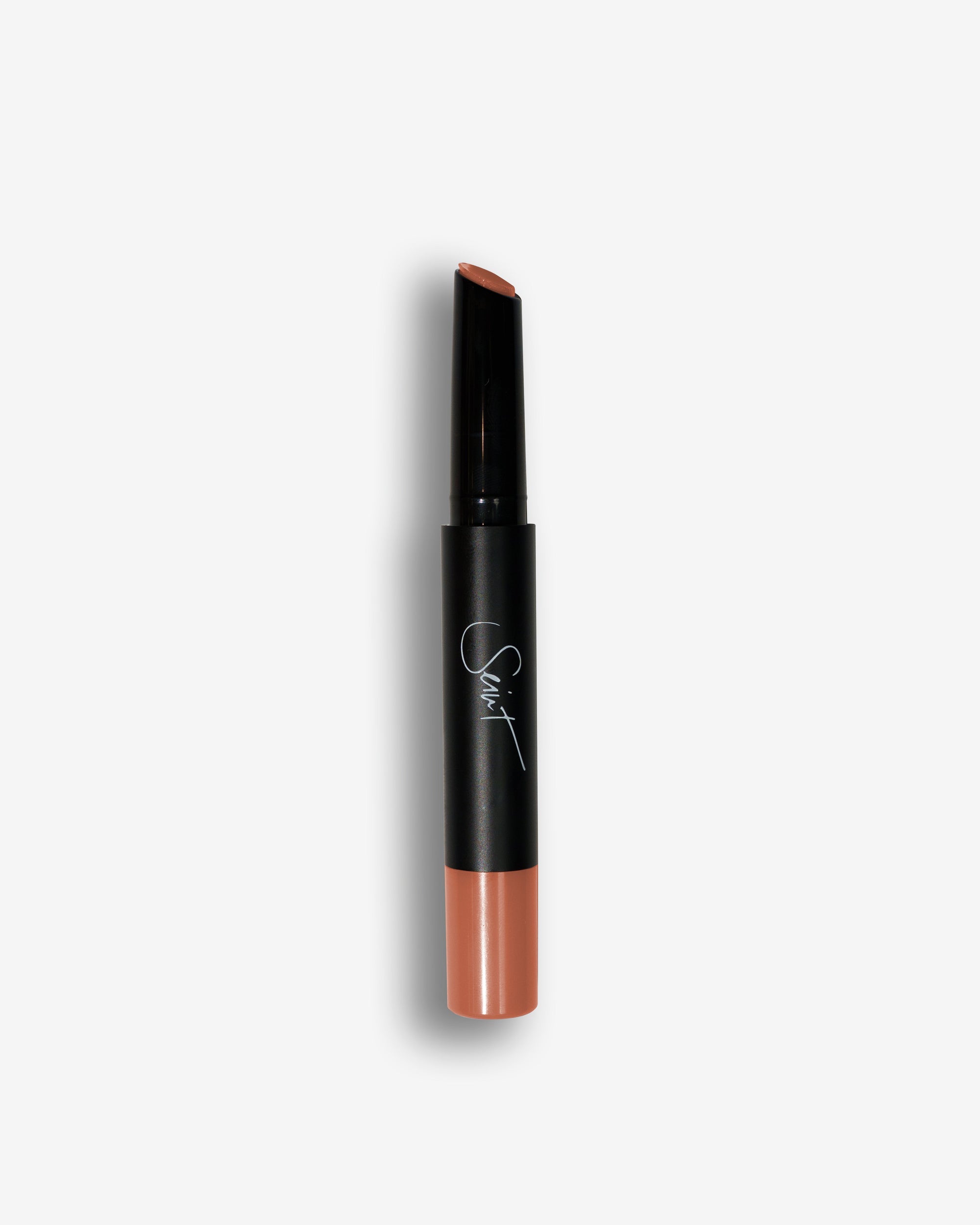 Seint Lip Gelato in Dulce, slanted black stick with a warm caramel-nude cream base
