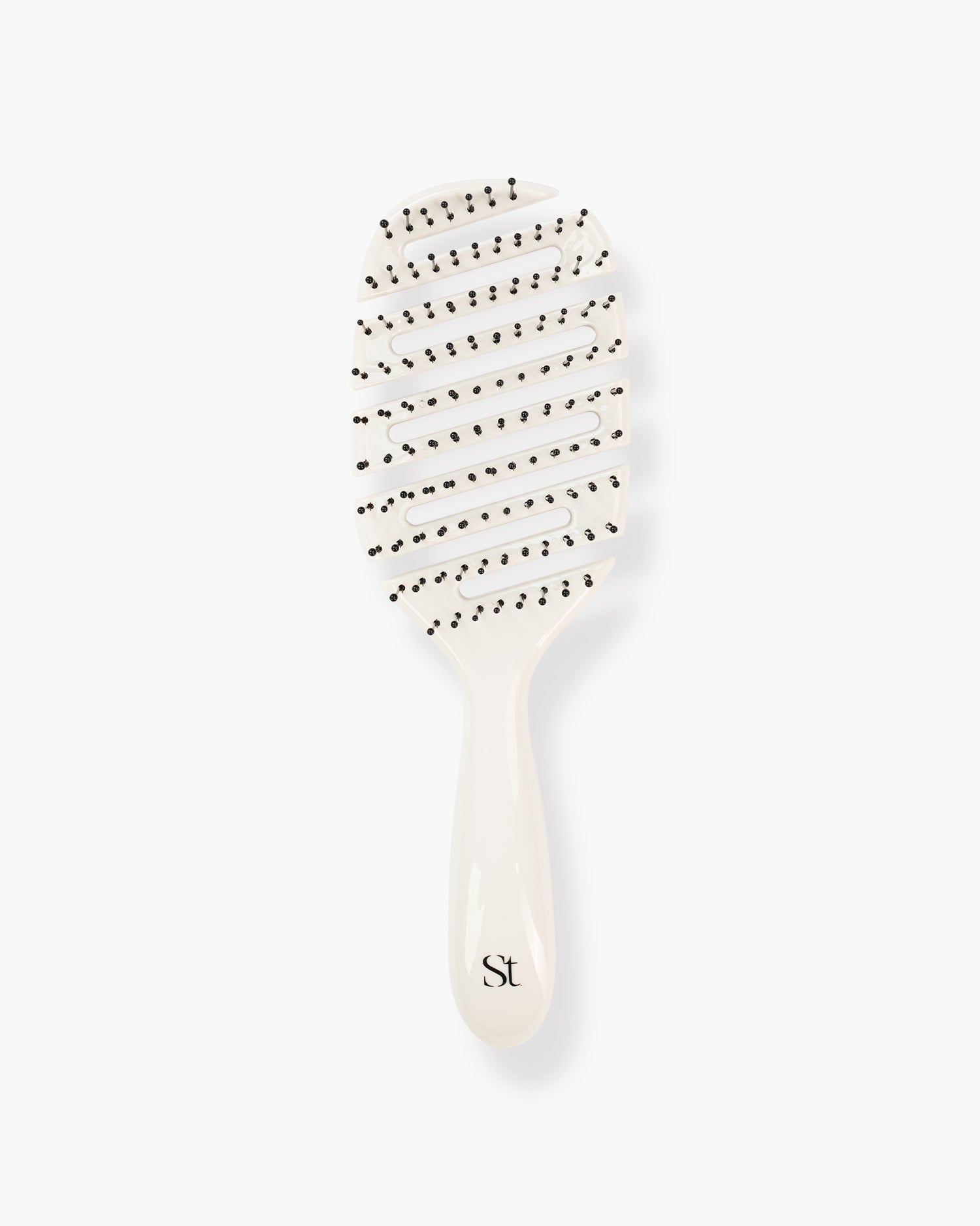 Seint Detangle Brush with vented flexible ivory body, curved slotted rows, and black ball-tipped bristles