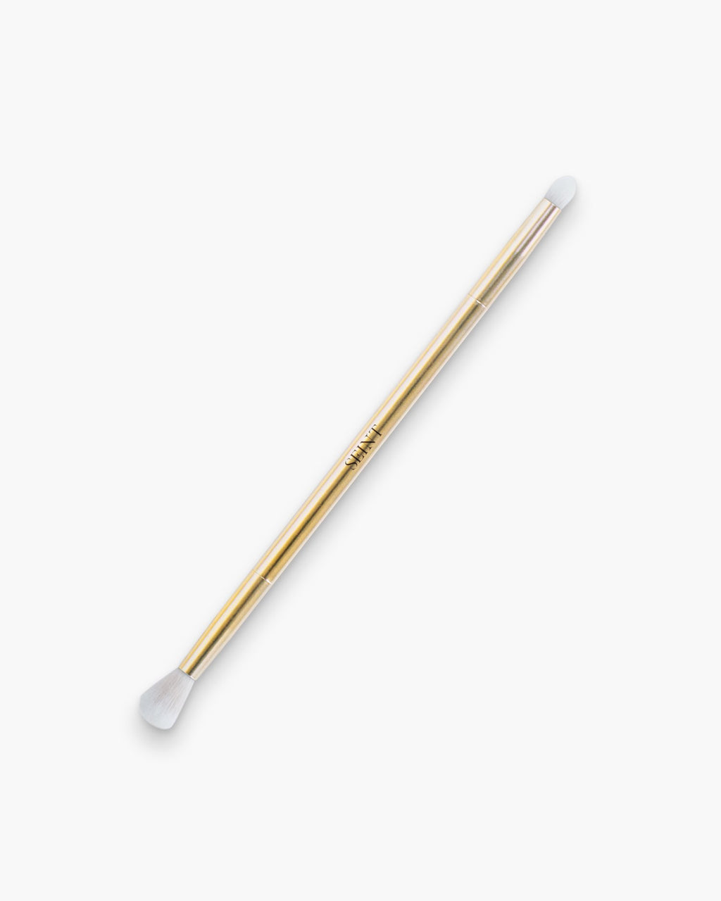Seint Eyeshadow Brush in gold — slim double-ended wand with a fluffy blending end and a small dense detail tip