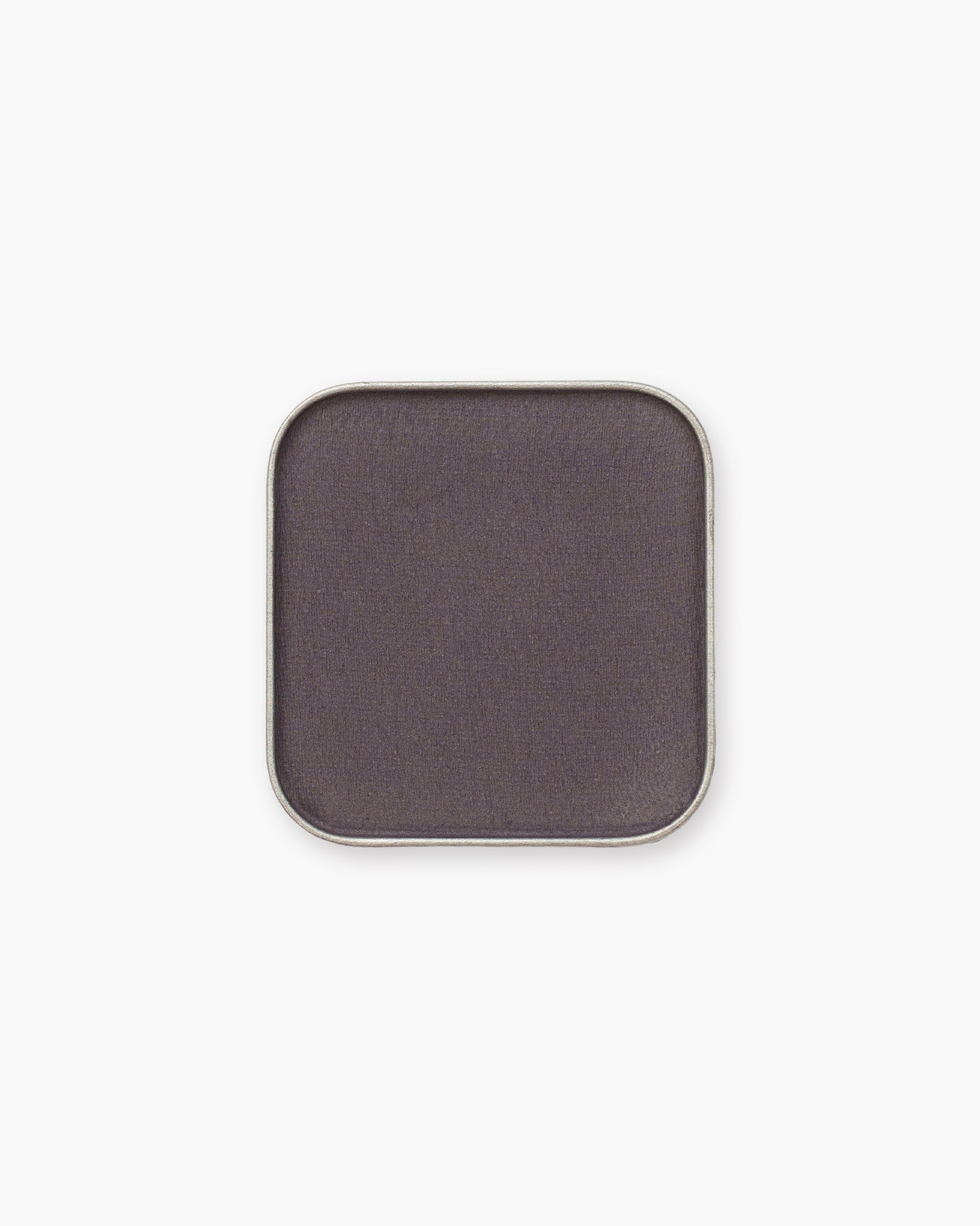 Seint Eyeshadow in Midnight — a matte deep charcoal with a plum cast