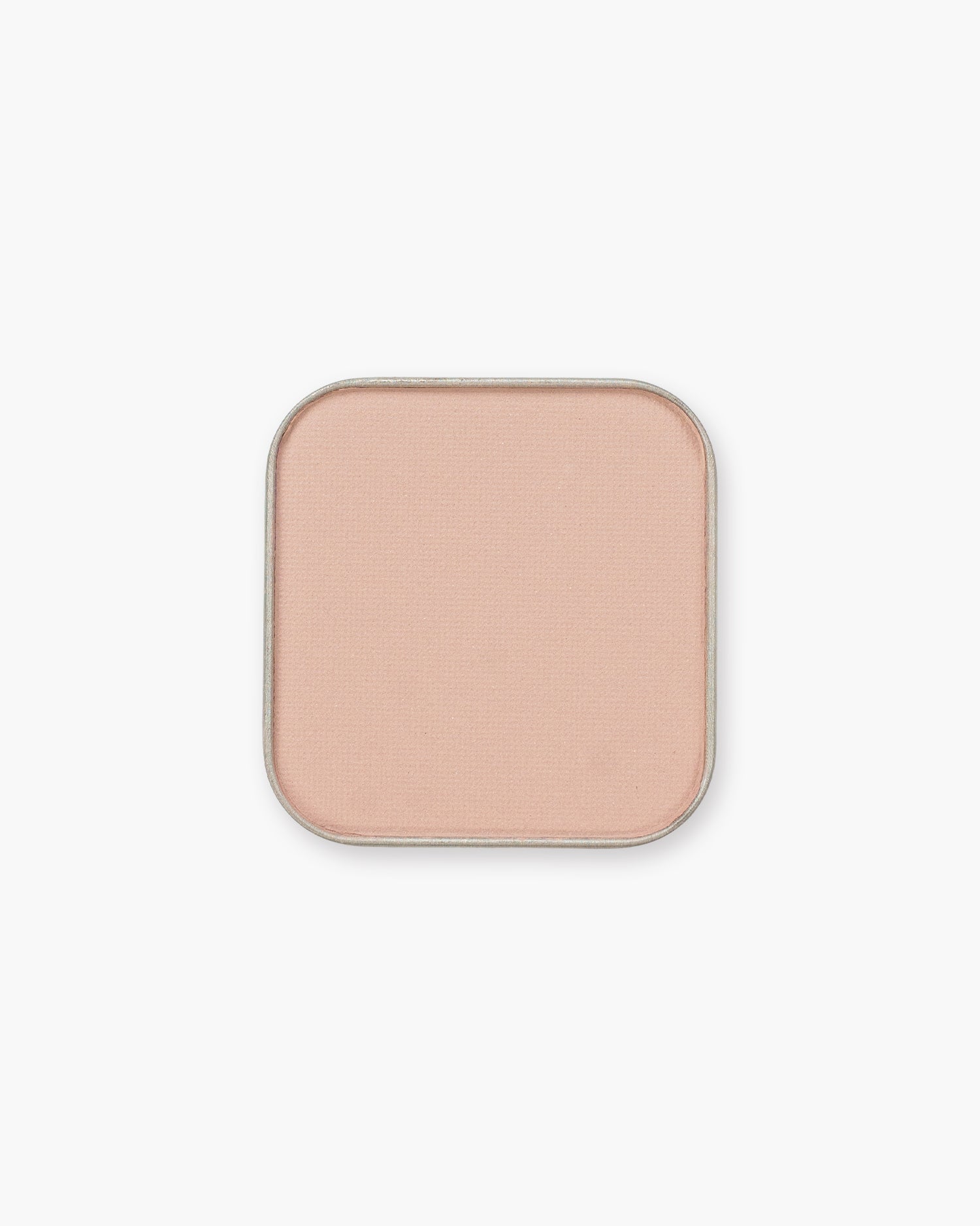 Seint Eyeshadow in Pup, a matte pale blush-nude in its metal pan