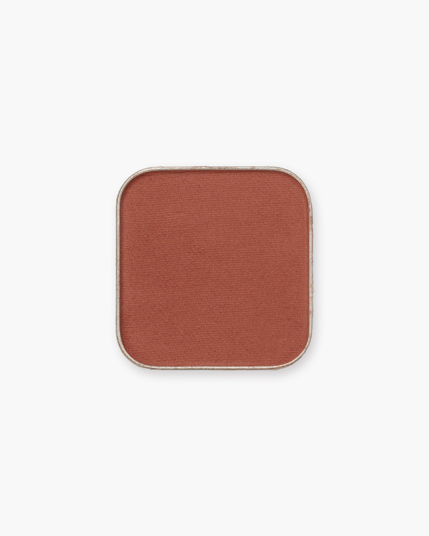 Seint Eyeshadow in Zion, a matte burnt-sienna rust in its square pan