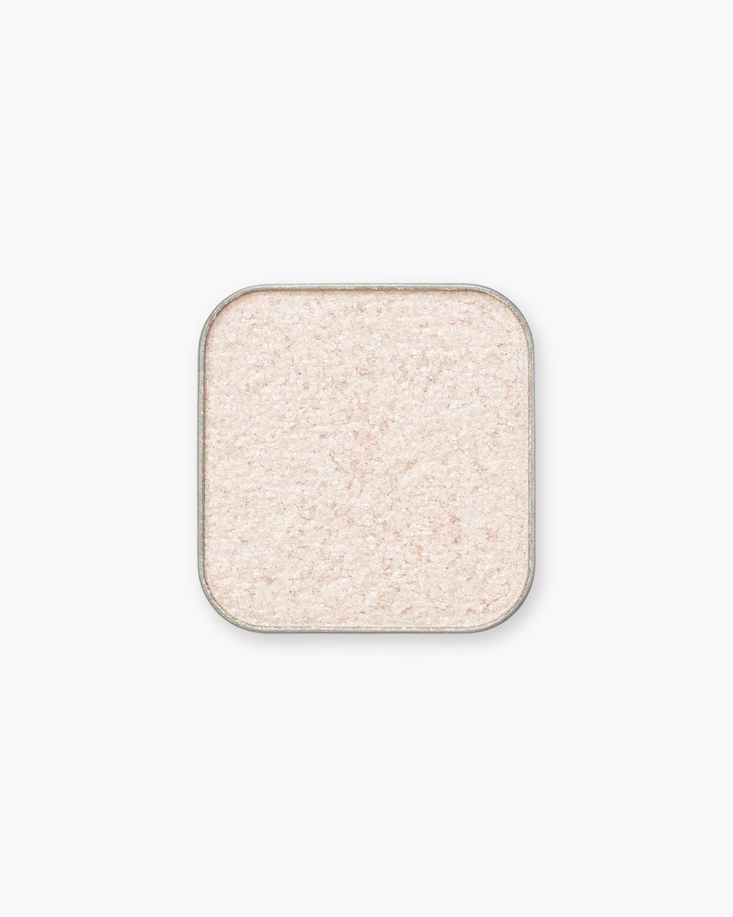 Seint Eyeshadow in Aries, a frosted pink-champagne shade flecked with fine sparkle