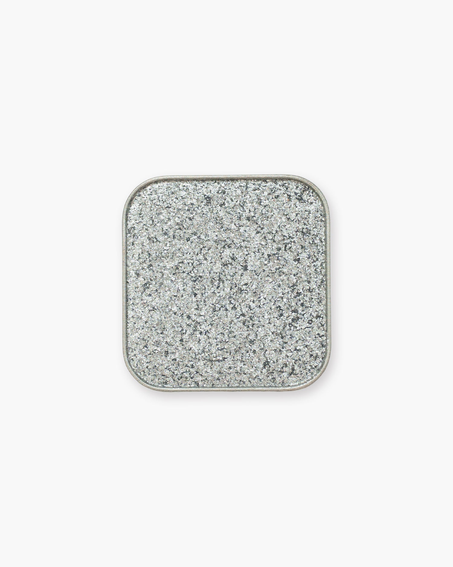 Seint Eyeshadow in Glass Slipper packed with chunky silver glitter flakes