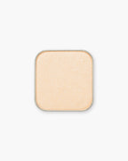 Seint Eyeshadow in Sabrina shows a soft peach-gold pan with a gentle shimmer
