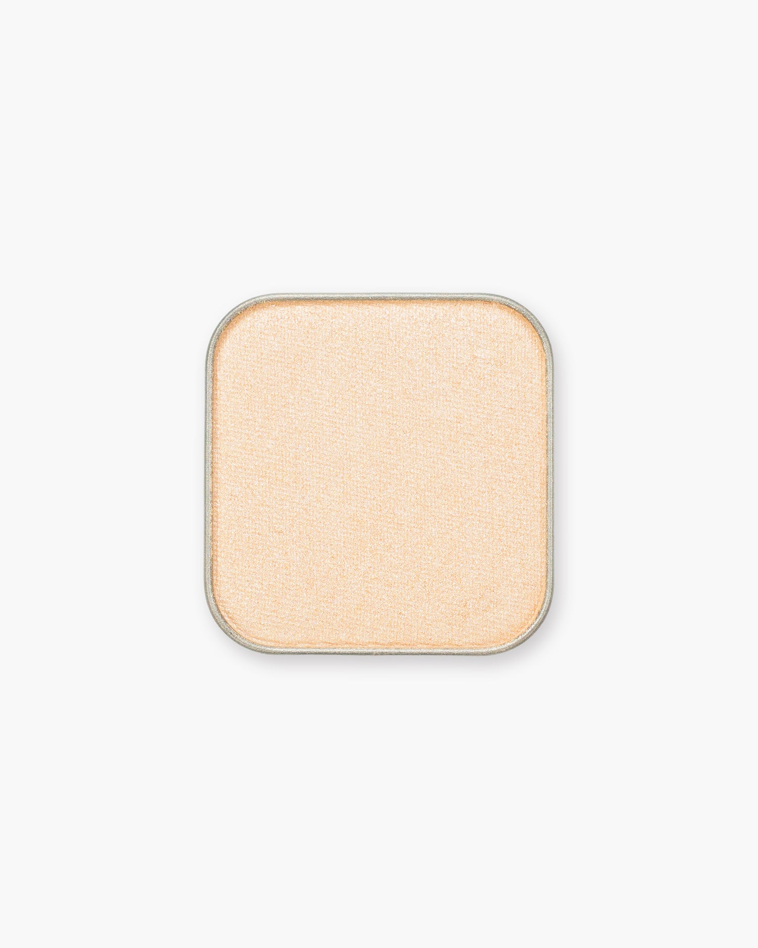 Seint Eyeshadow in Sabrina shows a soft peach-gold pan with a gentle shimmer