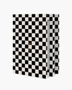 Seint IIID Palette 12 in Noir Damier, graphic black and cream checkerboard case standing partly open