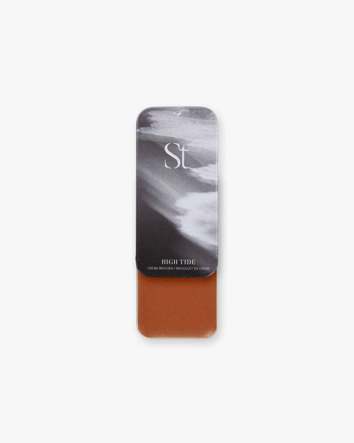 Seint Bronzer in High Tide, slide-open tin with black-and-white surf lid art and a rich terracotta cream