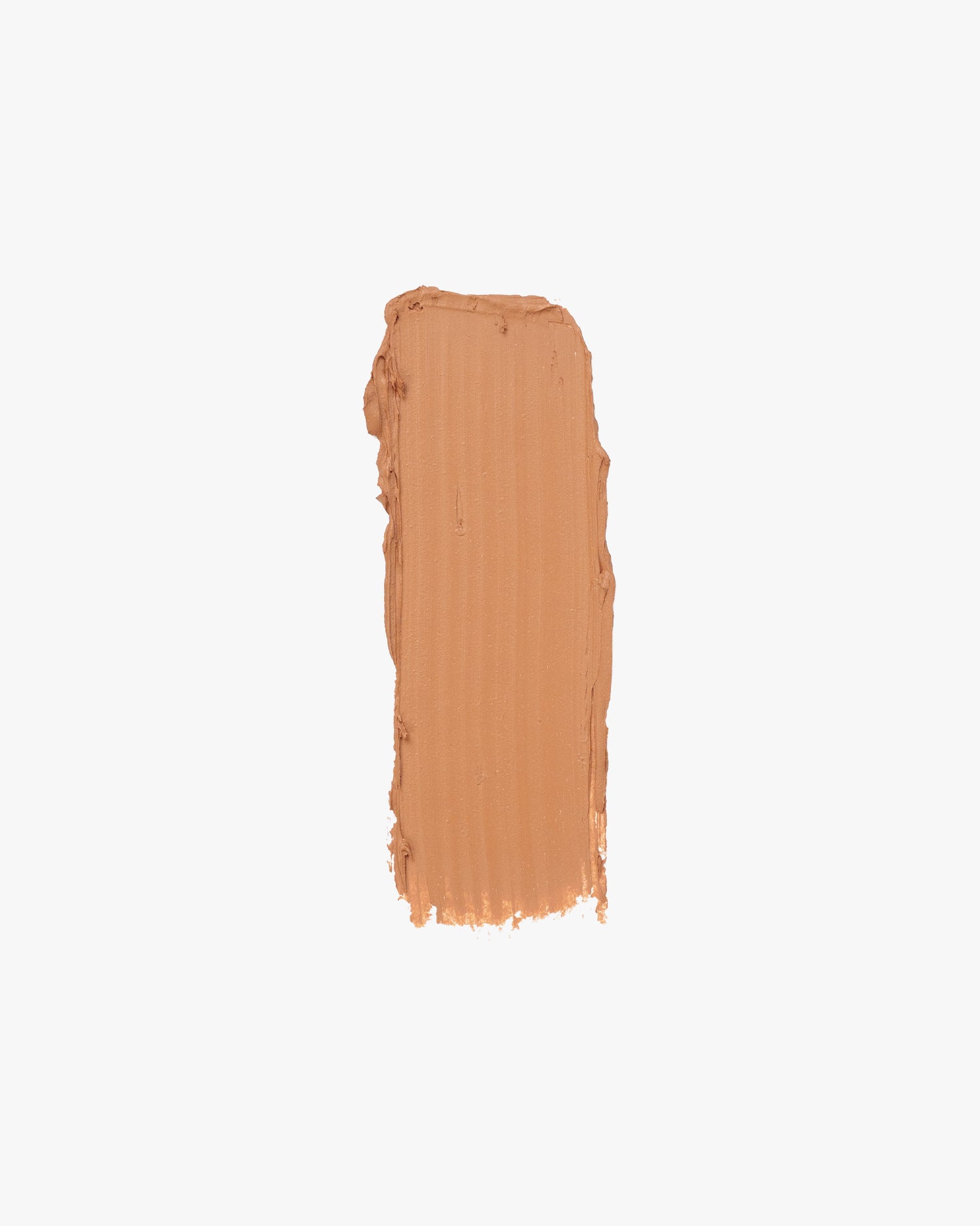 A rectangular swatch of light brown cream makeup with uneven edges is centered on a white background.