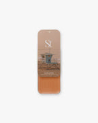Seint Bronzer in Tanlines, slide-open tin with lifeguard tower lid art and a light peachy-tan cream