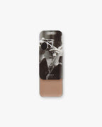 Seint Contour in Aspen: slide-open tin with black-and-white camera photo lid, revealing soft nude-taupe cream