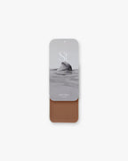 Seint Contour in Astoria: black-and-white sea-rock lid art over a soft rosy-brown cream