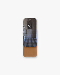 Seint Contour in Henna: tin with museum-hall statue lid art, opened to a warm amber-caramel cream