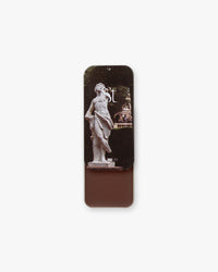 Seint Contour in Indigo: garden statue lid art, tin revealing a deep mahogany-brown cream