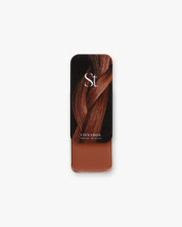 Seint Highlight in Cinnamon: rich sienna red-brown cream under a lid of braided auburn hair