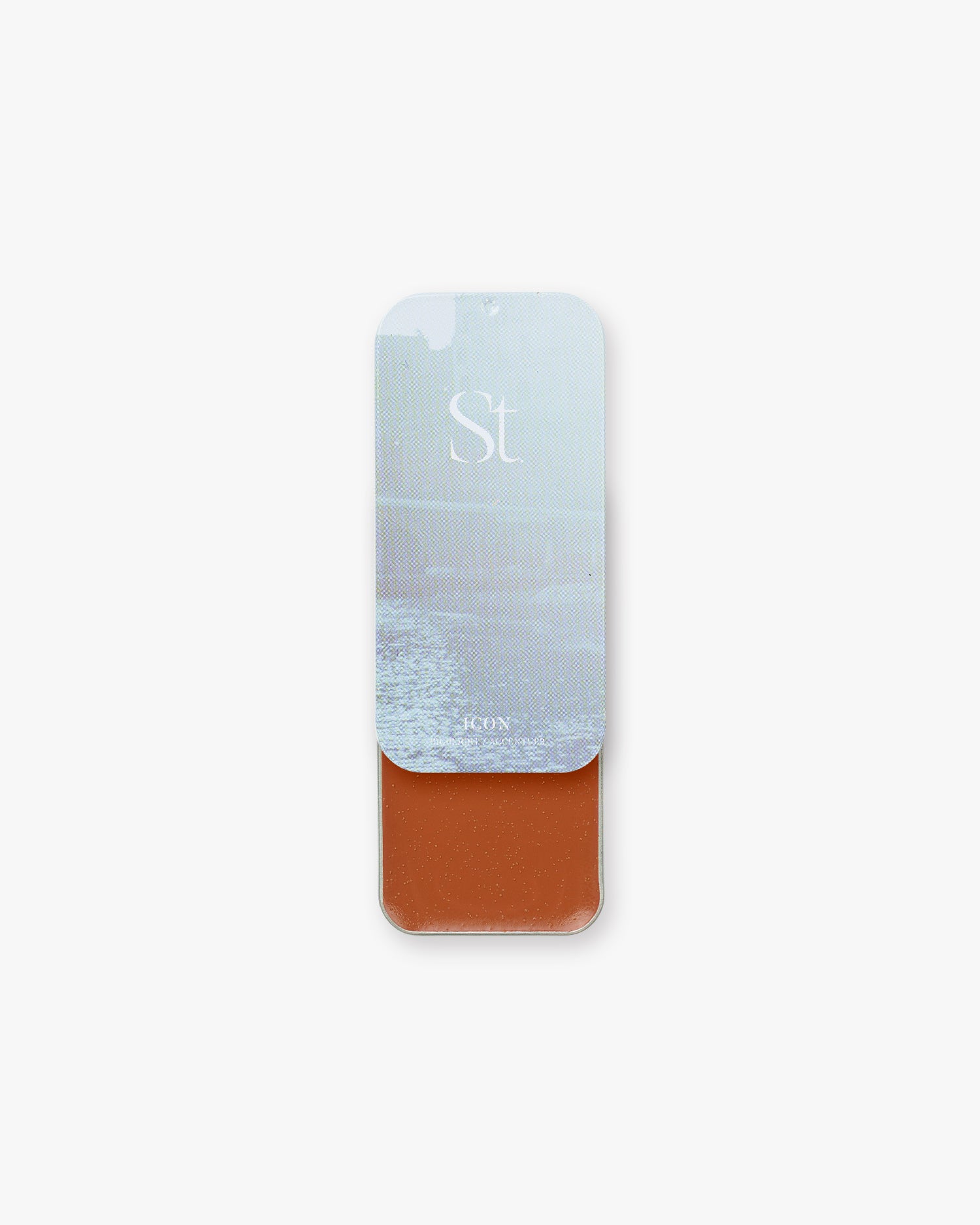Seint Highlight in Icon, deep rust red-brown cream in a slide tin with a misty ice-blue water lid