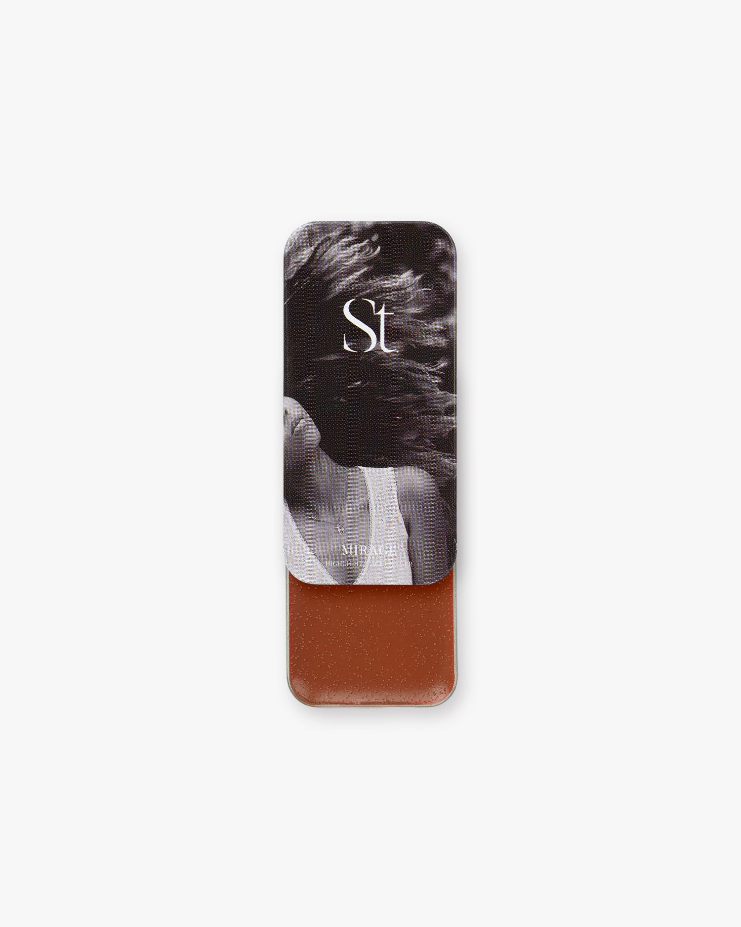 Seint Highlight in Mirage, deep russet-brown cream, lid showing a woman with windblown hair in black and white