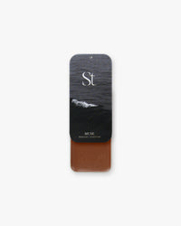 Seint Highlight in Muse, deep chocolate-brown cream beneath a black-and-white ocean wave lid