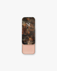 Seint Illuminator in Angel, open slide tin showing shimmering peachy-pink cream under baroque painting lid art