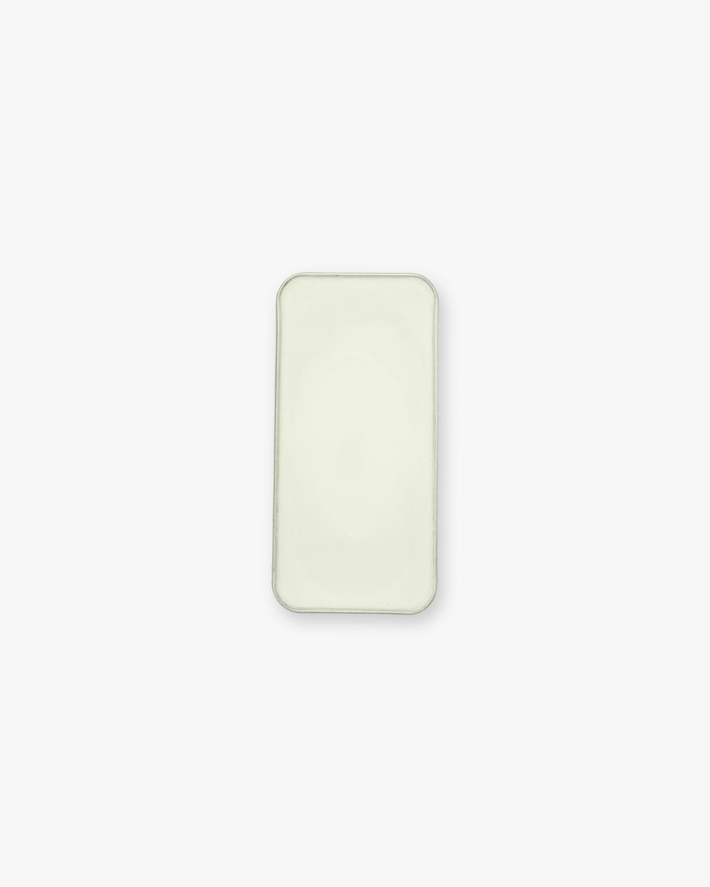 Seint Balm - Unscented from above — open tin filled with smooth, pale ivory balm on a white background