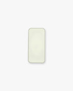 Seint Balm - Unscented from above — open tin filled with smooth, pale ivory balm on a white background