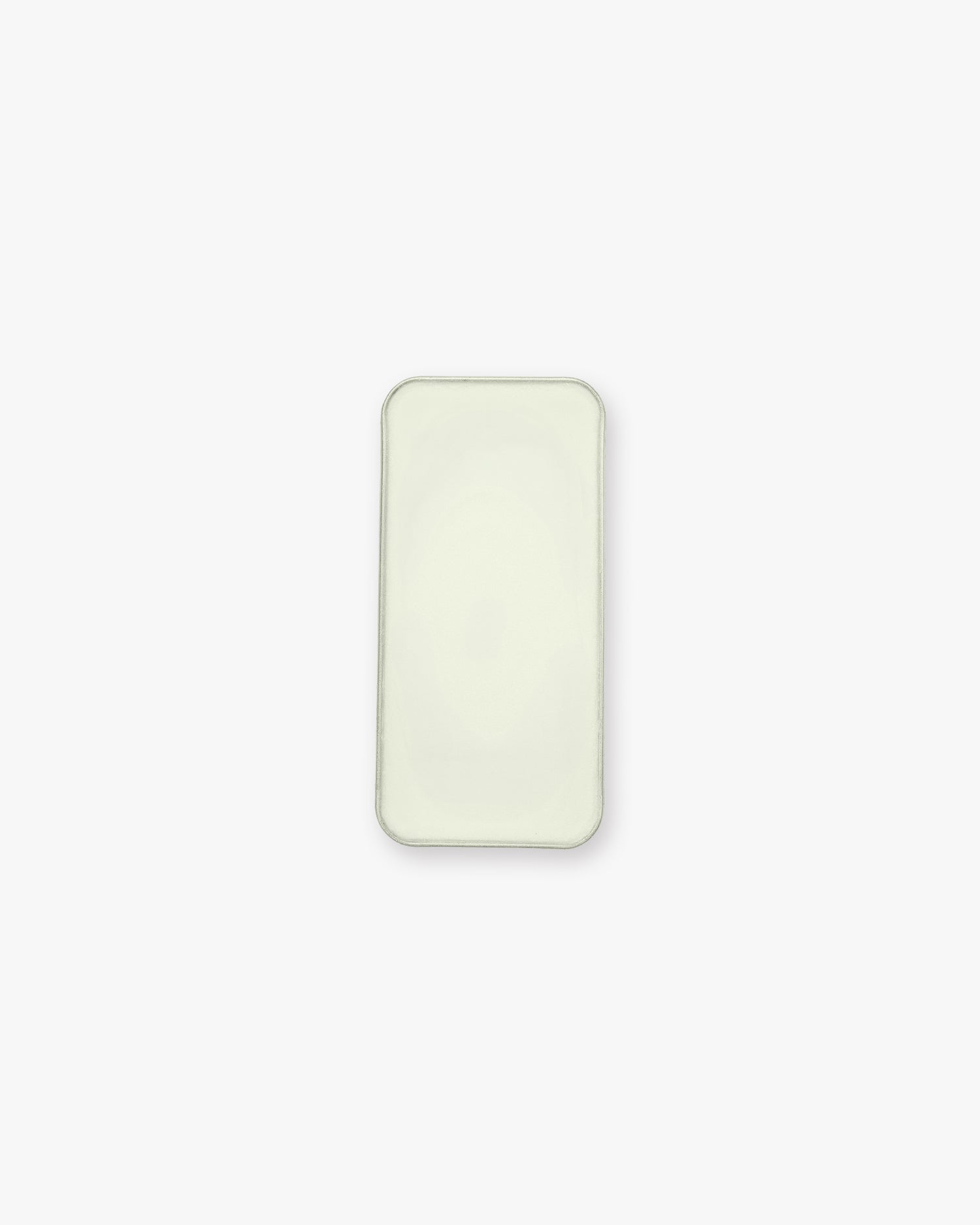 Seint Balm - Unscented from above — open tin filled with smooth, pale ivory balm on a white background