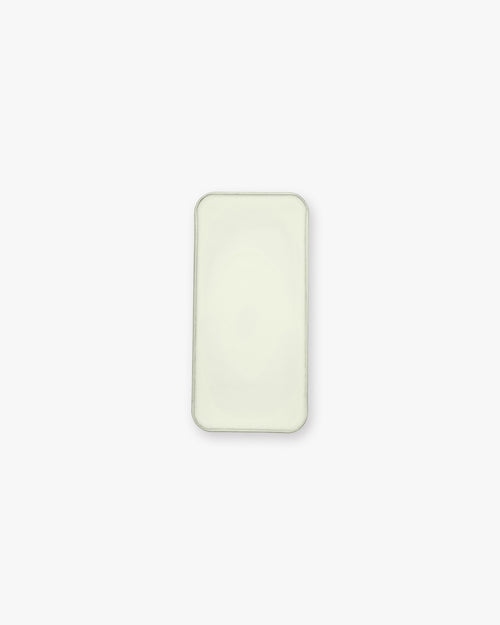 Seint Balm - Unscented from above — open tin filled with smooth, pale ivory balm on a white background