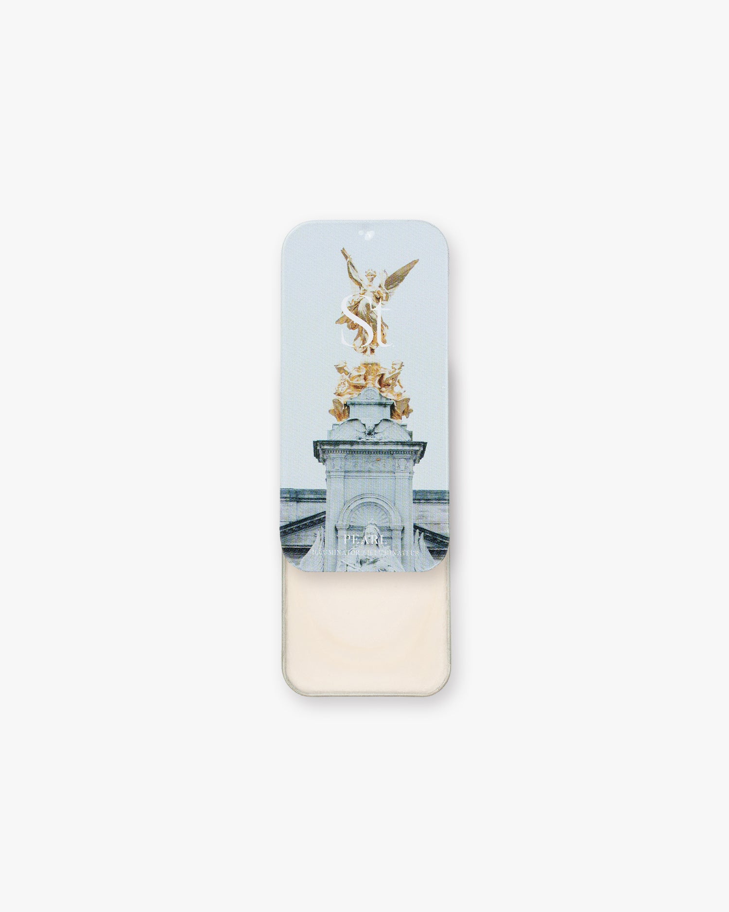 Seint Illuminator in Pearl, tin slid open to soft ivory cream beneath lid art of a gilded winged statue