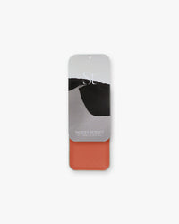 Seint Lip + Cheek in Desert Sunset, gloss finish — open tin of burnt-orange terracotta cream for lips and cheeks