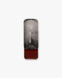 Seint Lip + Cheek in Royal, gloss finish — open tin of rich oxblood brick-red cream for lips and cheeks