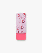 Seint Lip + Cheek in Dahlia, satin finish — slide-top tin open to a vivid warm-pink cream for lips and cheeks