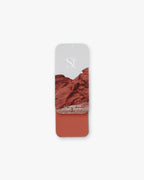 Seint Lip + Cheek in Sandstone, satin finish — open tin of muted clay-rose terracotta cream for lips and cheeks